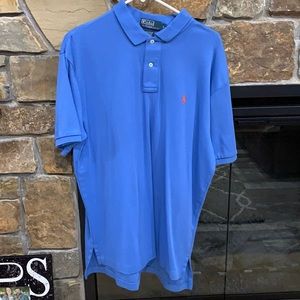 Blue polo with orange polo symbol